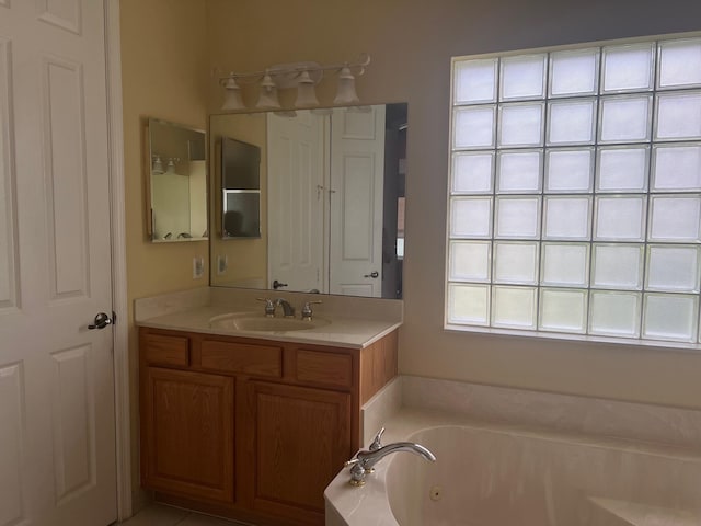 bathroom featuring vanity and a tub to relax in