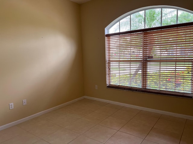 spare room with light tile patterned floors