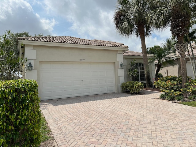 mediterranean / spanish-style house featuring a garage