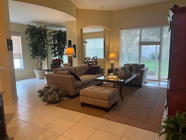 tiled living room featuring a healthy amount of sunlight