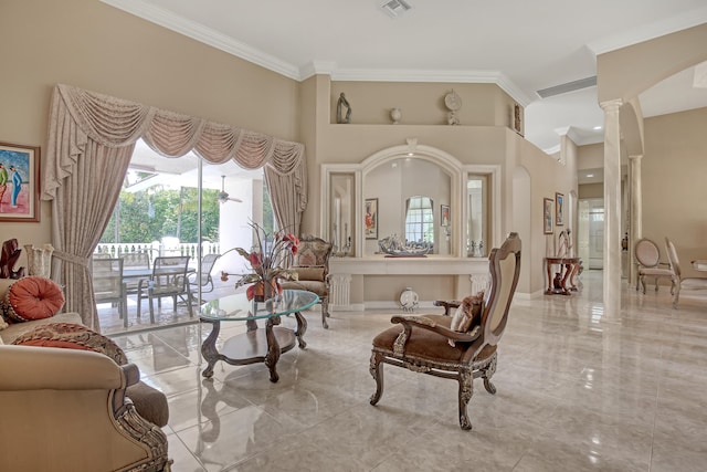 sitting room with ornamental molding, ornate columns, and light tile floors