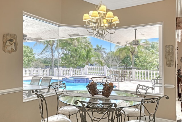 sunroom with a wealth of natural light and a chandelier