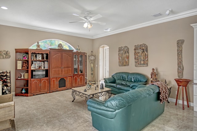 tiled living room featuring ornamental molding and ceiling fan