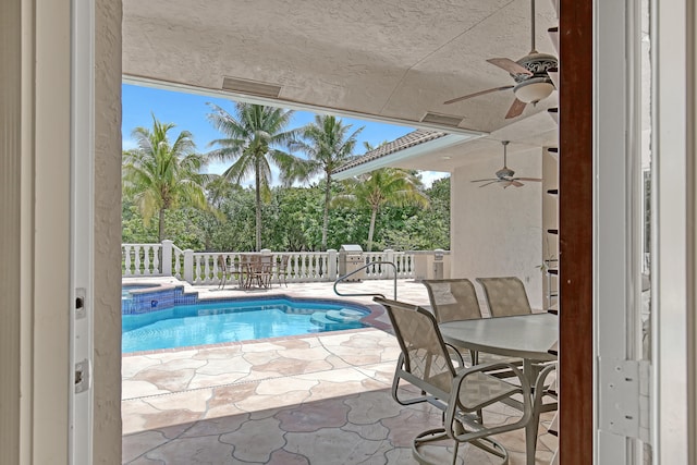 view of swimming pool with a patio and ceiling fan