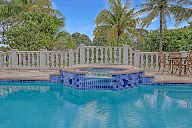 view of pool with a community hot tub