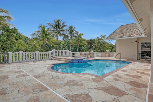 view of swimming pool featuring a patio area and an in ground hot tub