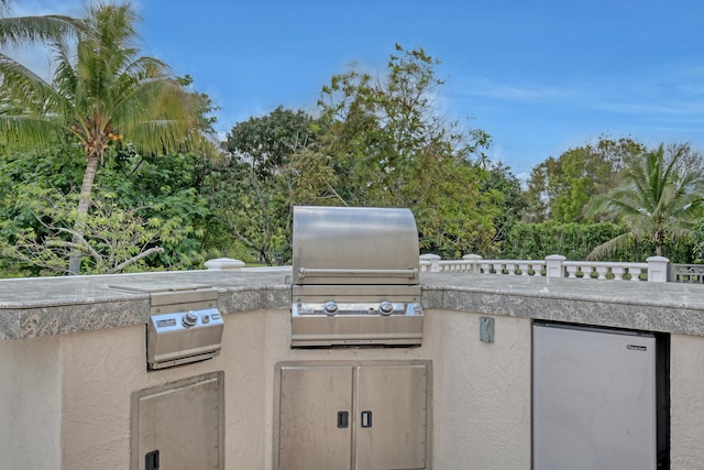 view of patio featuring a grill and an outdoor kitchen