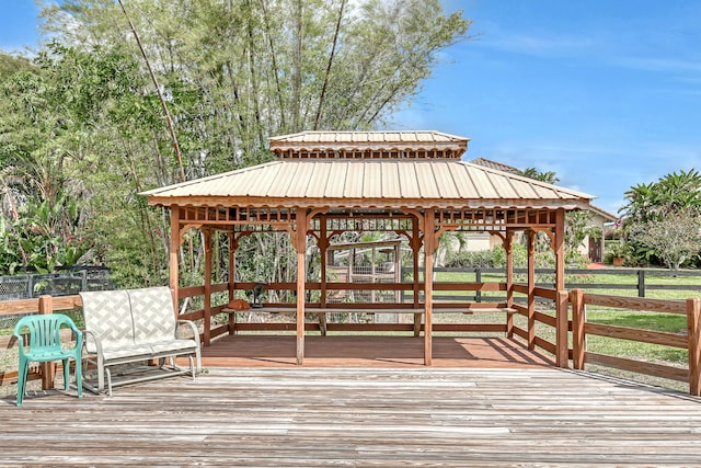 wooden terrace featuring a gazebo