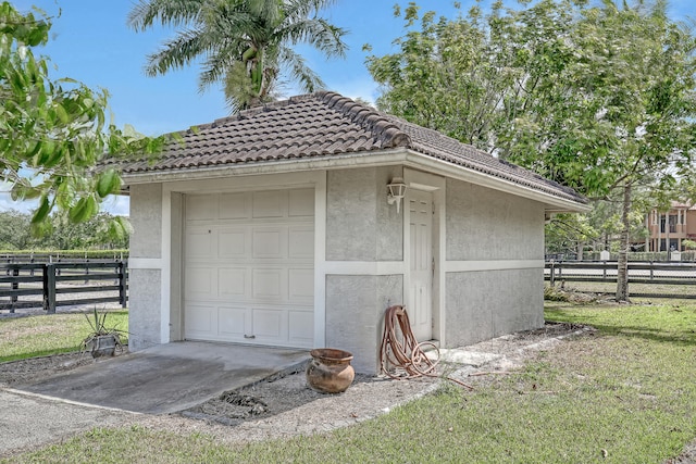 garage with a yard