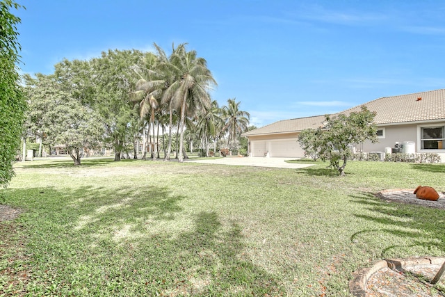 view of yard featuring a garage