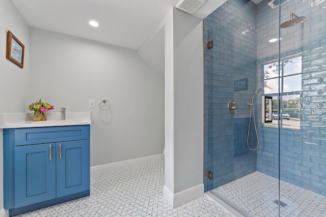 bathroom featuring vanity and walk in shower