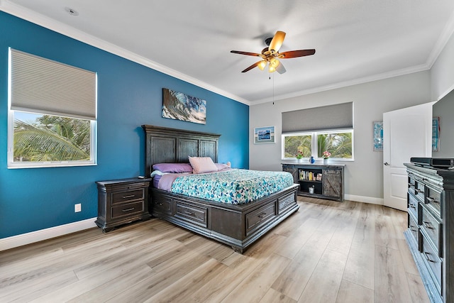 bedroom featuring crown molding, light hardwood / wood-style flooring, and ceiling fan