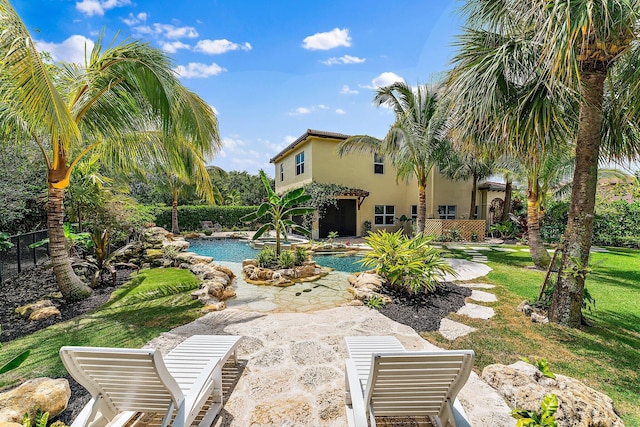 view of pool featuring a patio and a lawn