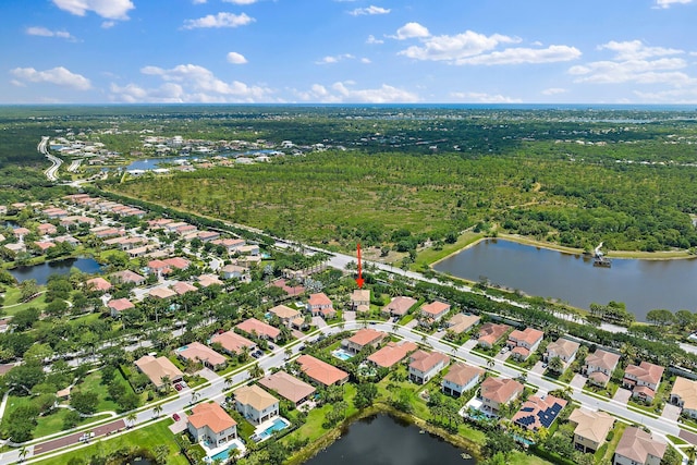 drone / aerial view with a water view