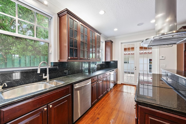 kitchen with sink, stainless steel dishwasher, light hardwood / wood-style flooring, crown molding, and decorative backsplash