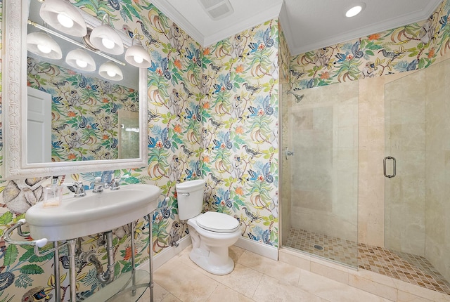 bathroom featuring ornamental molding, tile patterned flooring, an enclosed shower, and toilet