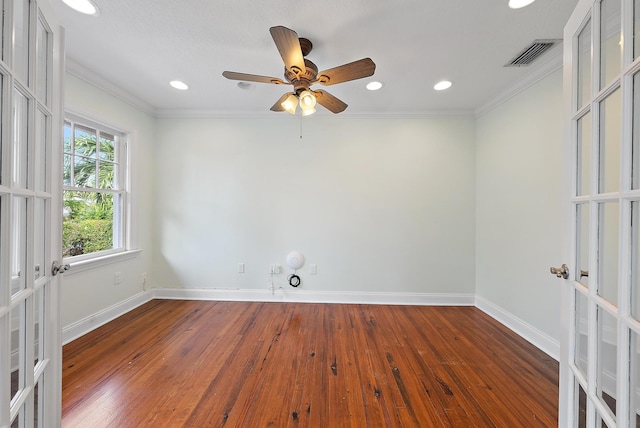 spare room featuring ceiling fan, french doors, dark hardwood / wood-style floors, and crown molding