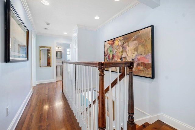 hallway with hardwood / wood-style flooring and crown molding