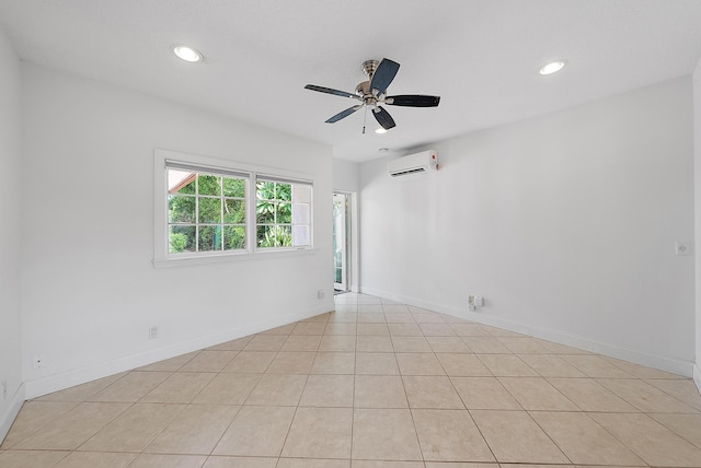 tiled spare room with a wall mounted air conditioner and ceiling fan