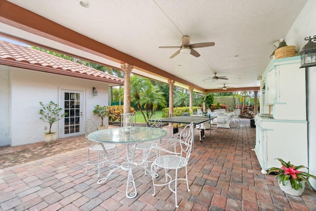 view of patio / terrace featuring ceiling fan and french doors