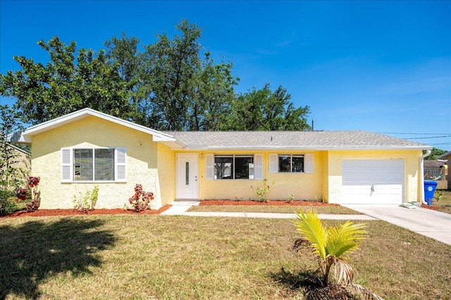 ranch-style home with a front yard and a garage