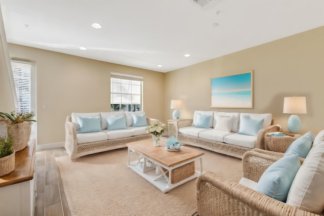 living room with light hardwood / wood-style flooring