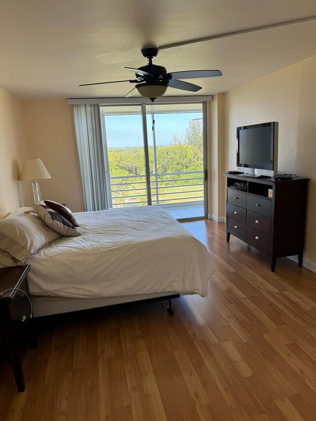 bedroom featuring access to outside, ceiling fan, and light hardwood / wood-style flooring