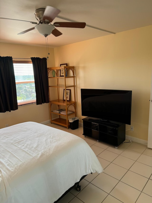 bedroom with light tile patterned floors and ceiling fan