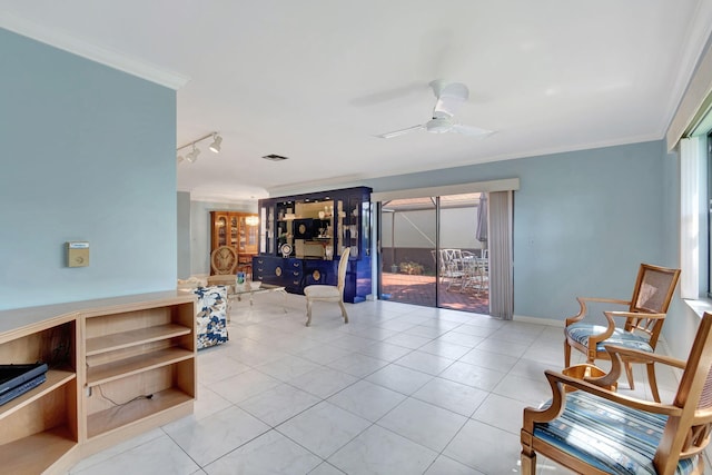 living area featuring ceiling fan, ornamental molding, and a wealth of natural light