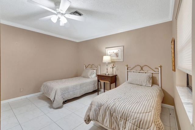 tiled bedroom featuring ceiling fan, a textured ceiling, and ornamental molding