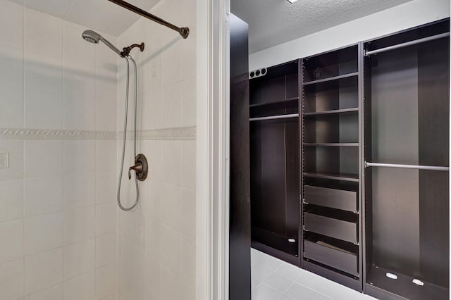 bathroom with tiled shower