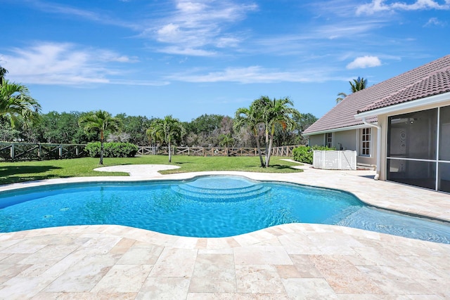 view of pool featuring a yard and a patio