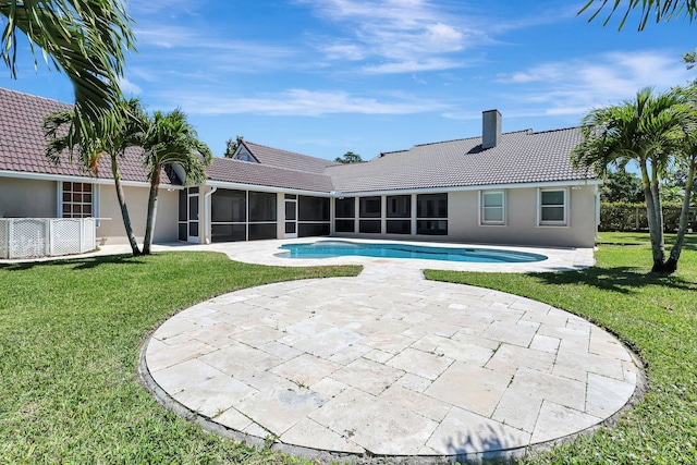 view of swimming pool featuring a yard and a patio