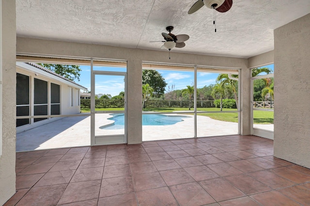 view of pool featuring ceiling fan