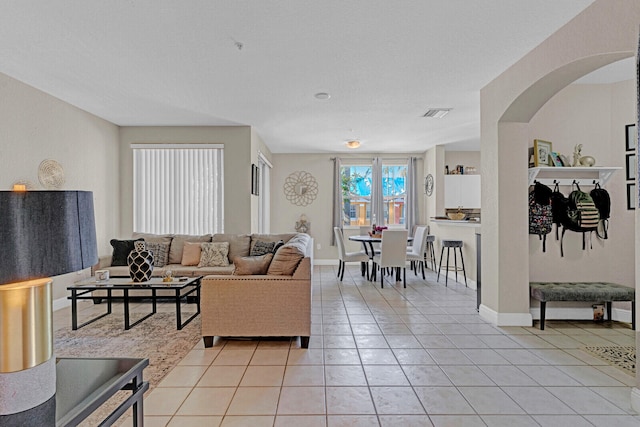 living room with light tile floors