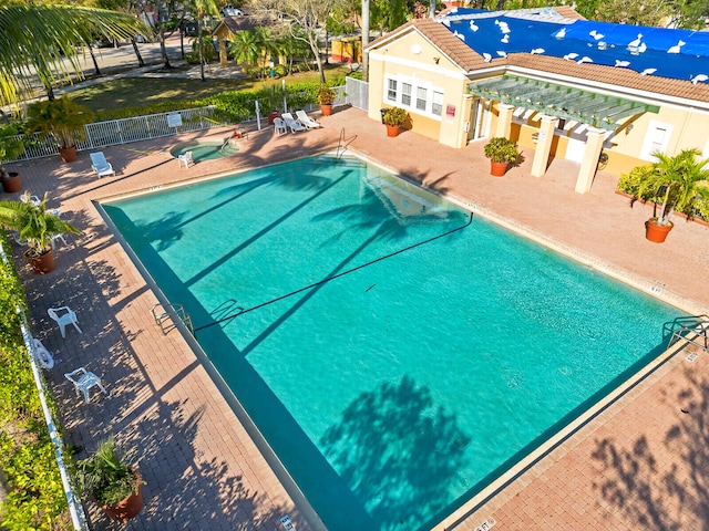 view of swimming pool with a patio