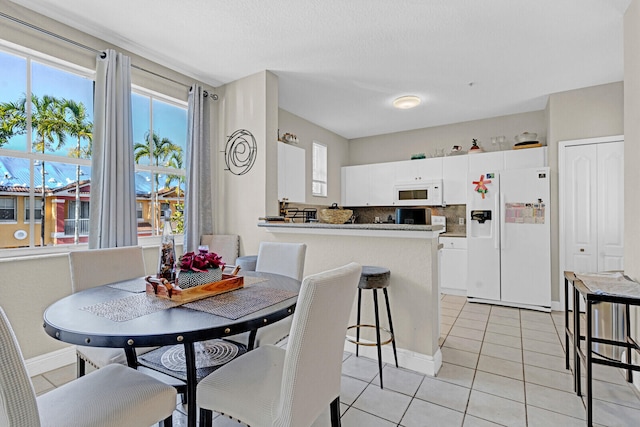 dining room with light tile flooring