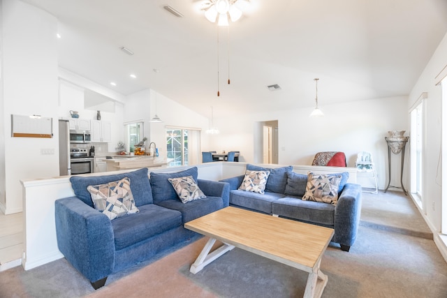 living room featuring high vaulted ceiling and ceiling fan