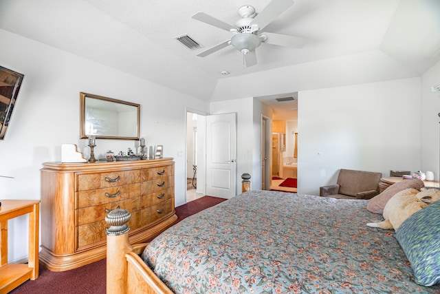 carpeted bedroom featuring ensuite bath, ceiling fan, and vaulted ceiling