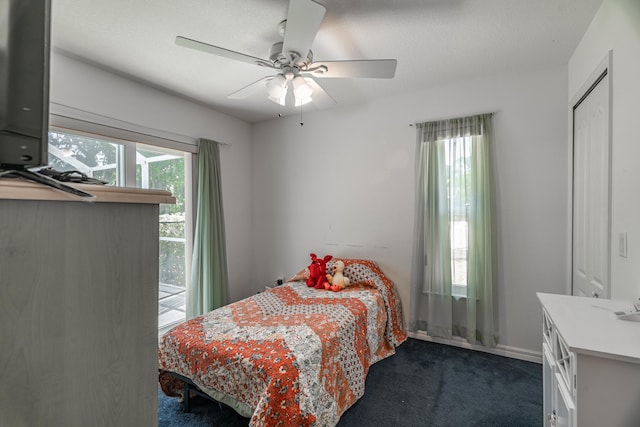 carpeted bedroom with ceiling fan