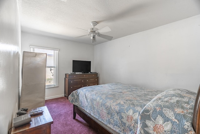 carpeted bedroom featuring ceiling fan and a textured ceiling