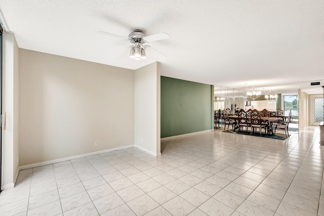 tiled empty room featuring ceiling fan with notable chandelier