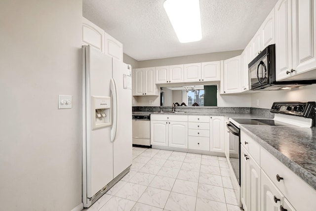 kitchen with a textured ceiling, white cabinets, sink, white appliances, and light tile flooring