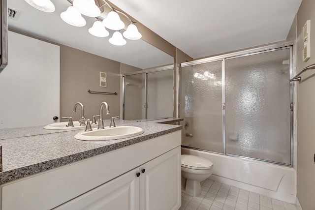 full bathroom with enclosed tub / shower combo, oversized vanity, toilet, and tile floors