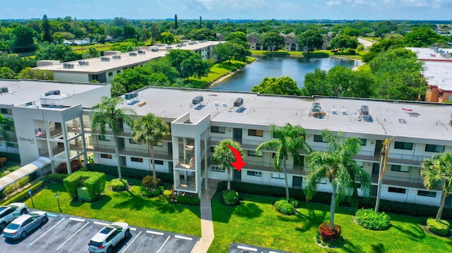 birds eye view of property featuring a water view