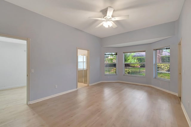 spare room featuring ceiling fan and light wood-type flooring