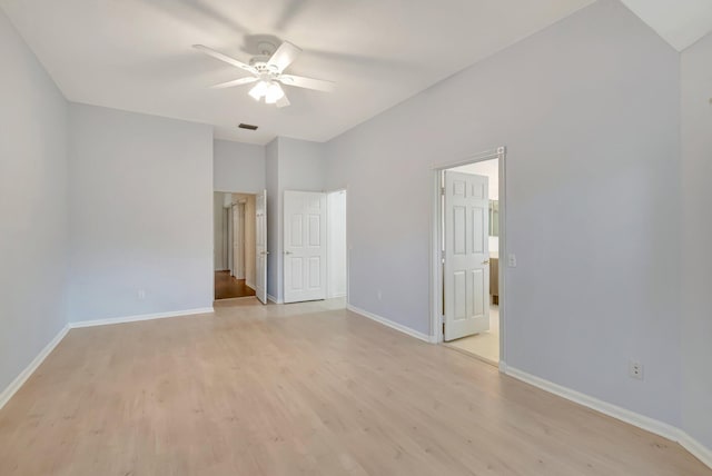 empty room featuring ceiling fan and light wood-type flooring