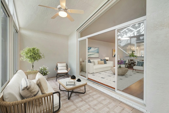 sunroom with ceiling fan