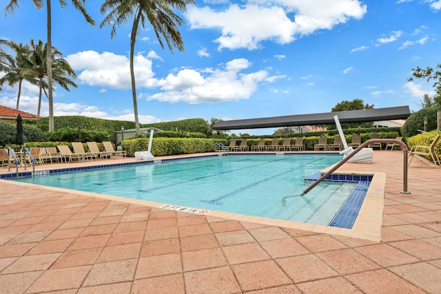 view of swimming pool with a patio