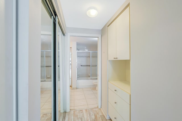 hall with light hardwood / wood-style floors